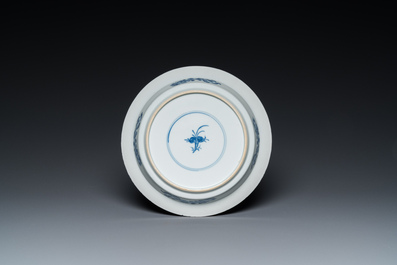 A Chinese blue and white 'two phoenixes and an immortal' plate, Kangxi/Yongzheng