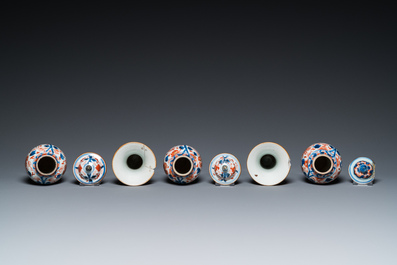 A Chinese grisaille garniture of five 'phoenix' vases, Kangxi/Yongzheng