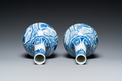 A pair of Chinese blue and white bottle vases with mythical animals, 19th C.