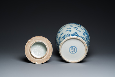 A Chinese blue and white 'dragons and phoenixes' vase and cover, Kangxi mark, 19th C.