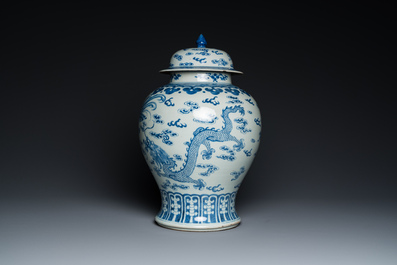 A Chinese blue and white 'dragons and phoenixes' vase and cover, Kangxi mark, 19th C.