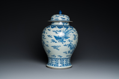 A Chinese blue and white 'dragons and phoenixes' vase and cover, Kangxi mark, 19th C.