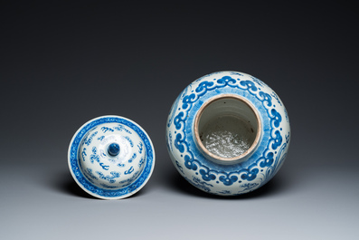 A Chinese blue and white 'dragons and phoenixes' vase and cover, Kangxi mark, 19th C.