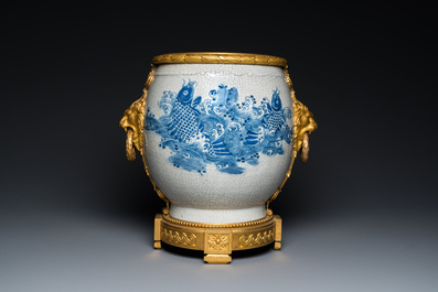 A large Chinese blue and white crackle-glazed 'carps' vase with fine gilt bronze mounts, 18/19th C.