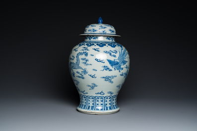 A Chinese blue and white 'dragons and phoenixes' vase and cover, Kangxi mark, 19th C.