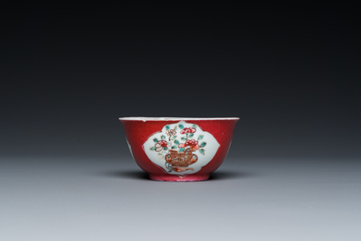 A Chinese famille rose ruby-ground cup and saucer, Yongzheng
