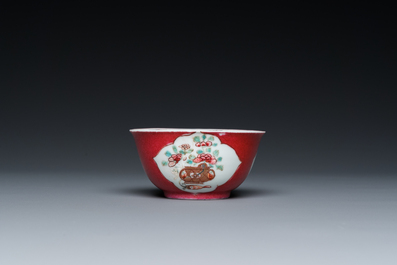 A Chinese famille rose ruby-ground cup and saucer, Yongzheng