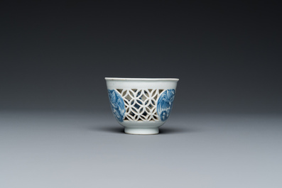 A rare Chinese reticulated double-walled blue and white 'phoenix' cup, Kangxi