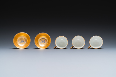 Onze soucoupes et dix tasses en porcelaine de Chine monogramm&eacute;es 'PM' sur fond dor&eacute;, Yongzheng/Qianlong