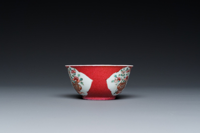 A Chinese famille rose ruby-ground cup and saucer, Yongzheng