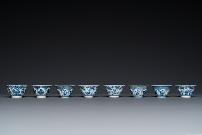 Twelve Chinese blue and white saucers and eight cups, Kangxi