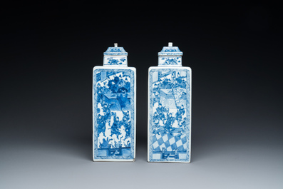 A pair of Chinese blue and white square 'narrative subject' vases and covers, Kangxi