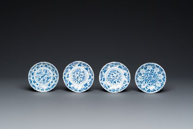 Twelve Chinese blue and white saucers and eight cups, Kangxi