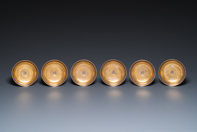 Onze soucoupes et dix tasses en porcelaine de Chine monogramm&eacute;es 'PM' sur fond dor&eacute;, Yongzheng/Qianlong
