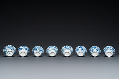 Twelve Chinese blue and white saucers and eight cups, Kangxi