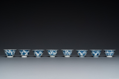 Twelve Chinese blue and white saucers and eight cups, Kangxi