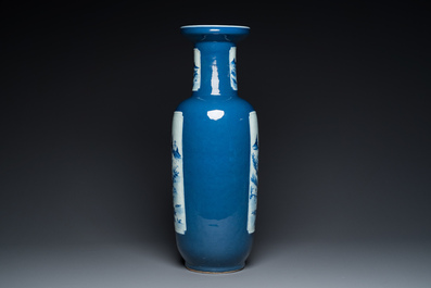 A Chinese blue-ground rouleau vase with blue and white landscape panels, 19th C.