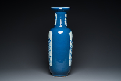 A Chinese blue-ground rouleau vase with blue and white landscape panels, 19th C.