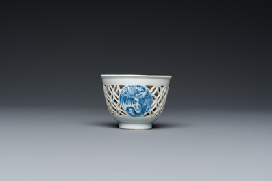A rare Chinese reticulated double-walled blue and white 'phoenix' cup, Kangxi