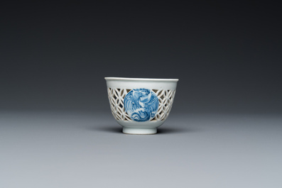 A rare Chinese reticulated double-walled blue and white 'phoenix' cup, Kangxi