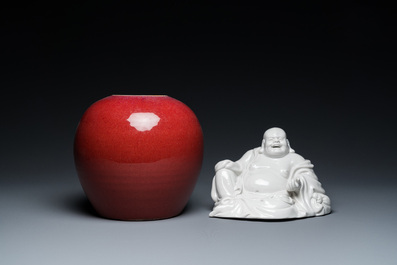 A Chinese sang-de-boeuf-glazed jar, a blanc de Chine Buddha and two plates, 19th C.