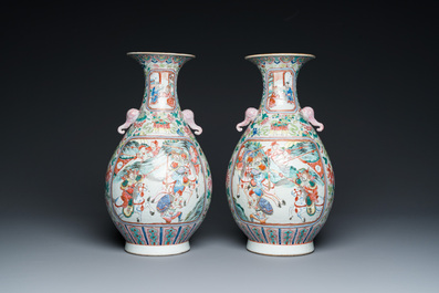 A pair of Chinese famille rose vases with elephant handles, 19th C.