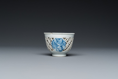 A rare Chinese reticulated double-walled blue and white 'phoenix' cup, Kangxi