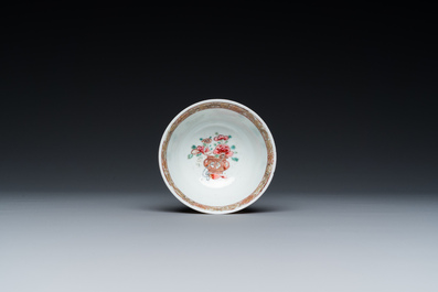 A Chinese famille rose ruby-ground cup and saucer, Yongzheng