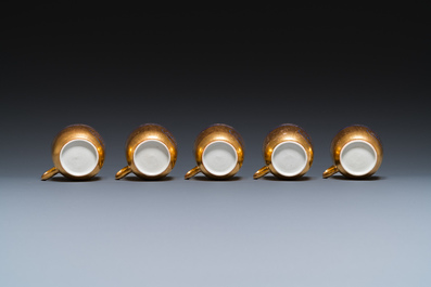 Onze soucoupes et dix tasses en porcelaine de Chine monogramm&eacute;es 'PM' sur fond dor&eacute;, Yongzheng/Qianlong