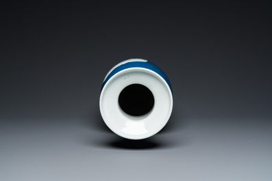 A Chinese blue-ground rouleau vase with blue and white landscape panels, 19th C.