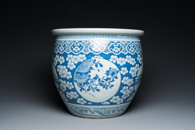 A Chinese blue and white fish bowl with medallions on a prunus-ground, 19th C.