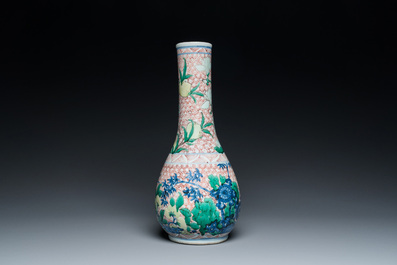 A Chinese wucai bottle vase with birds surrounded by fruits and foliage, Transitional period
