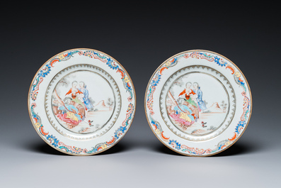 A pair of fine Chinese famille rose plates with a musician playing in front of a couple, Qianlong