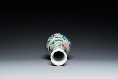 A Chinese wucai bottle vase with birds surrounded by fruits and foliage, Transitional period