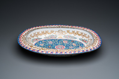 A large Chinese Canton enamel basin with garlands decorated with male heads, Qianlong