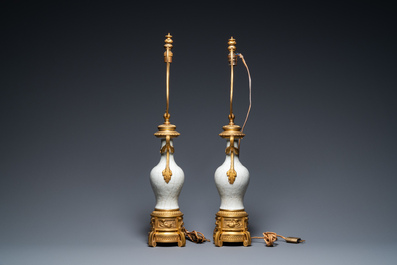 A pair of Chinese gilt bronze lamp-mounted crackle-glazed vases, 18/19th C.