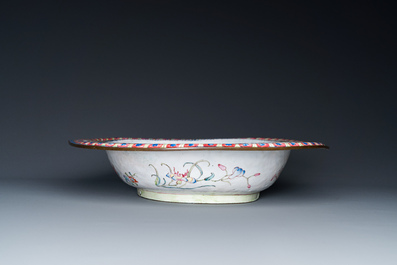 A large Chinese Canton enamel basin with garlands decorated with male heads, Qianlong