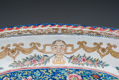 A large Chinese Canton enamel basin with garlands decorated with male heads, Qianlong