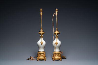 A pair of Chinese gilt bronze lamp-mounted crackle-glazed vases, 18/19th C.