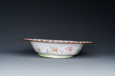 A large Chinese Canton enamel basin with garlands decorated with male heads, Qianlong