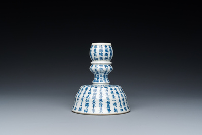 A Chinese blue and white inscribed candlestick, Jin Yu Zhu Ji 金玉珠記 mark, 19th C.