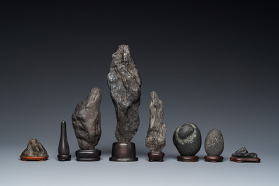 Eight Chinese 'gongshi or 'scholar's rocks' on wooden stands, Republic