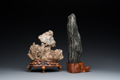 Two Chinese 'gongshi or 'scholar's rocks' on wooden stands, Ming or later