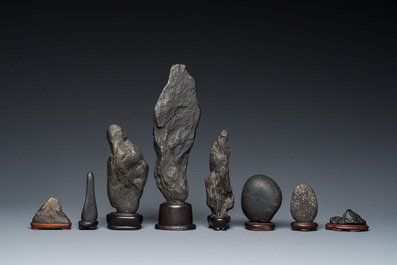 Eight Chinese 'gongshi or 'scholar's rocks' on wooden stands, Republic