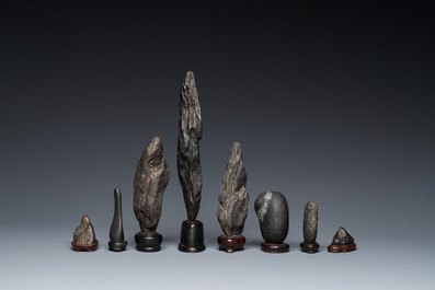 Eight Chinese 'gongshi or 'scholar's rocks' on wooden stands, Republic