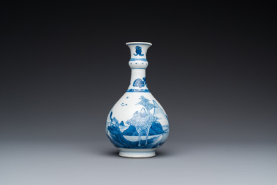 A Chinese blue and white bottle vase with figures in a landscape, Kangxi