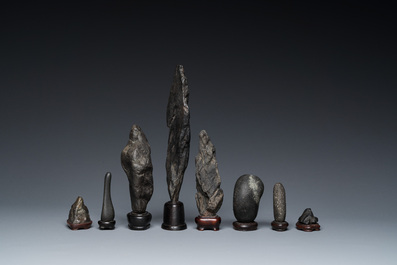 Eight Chinese 'gongshi or 'scholar's rocks' on wooden stands, Republic