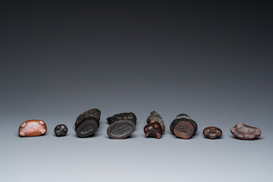 Eight Chinese 'gongshi or 'scholar's rocks' on wooden stands, Republic