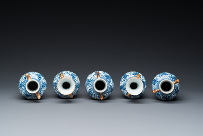 Een Chinees blauw-wit kaststel van vijf vazen met floraal decor, Kangxi