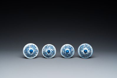 Een Chinees blauw-wit kaststel van zes vazen met floraal decor, Kangxi